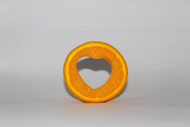 A delicious orange slices with a love shape hole