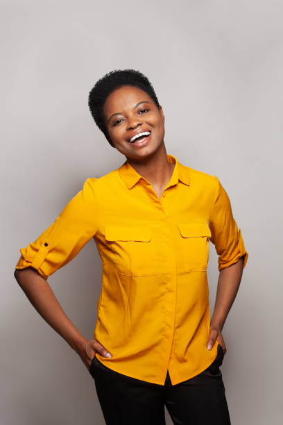 istock Attractive successful woman smiling and having fun against studio wall banner background 2150480650