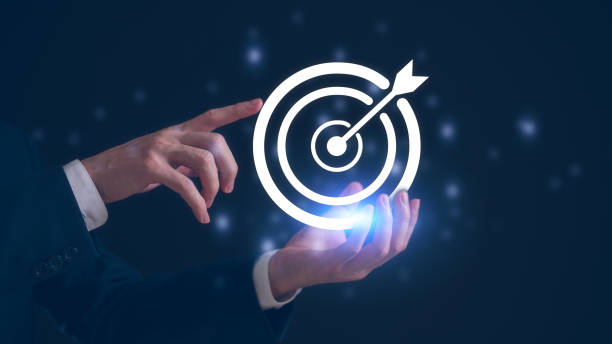 istock Hand holding virtual target board and arrow. Business achievement goal and objective target concept 2150482060