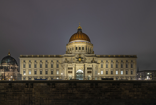 Berlin, Germany - Dec 19, 2023 - The Berlin Palace (Berliner Schloss) at night, which houses the Humboldt Forum museum building, is a museum dedicated to human history, art and culture, Space for text, Selective focus.