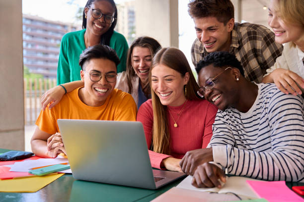 istock A large group of young multiracial students gathered in classroom smiling and having fun watching 2150483126