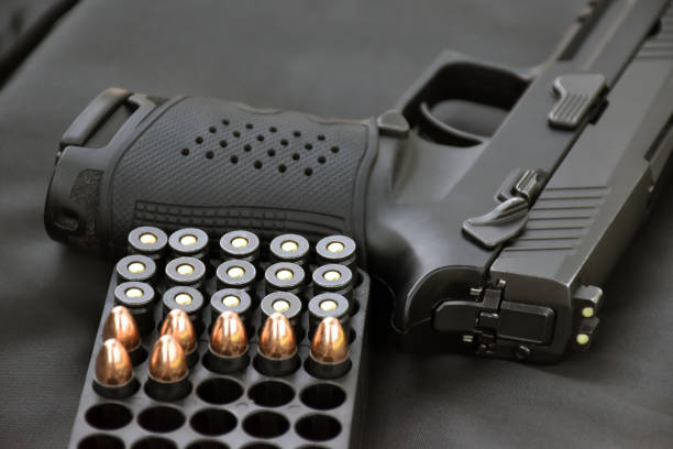istock 9mm pistol gun and bullets 2150484048