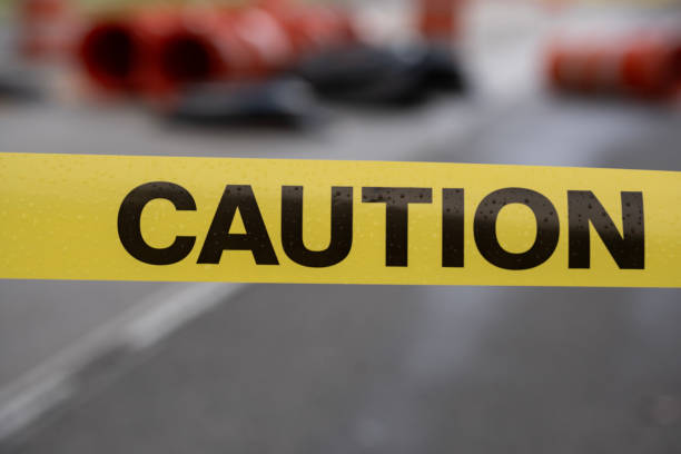 istock yellow warning caution sign outdoors in the city 2150489786