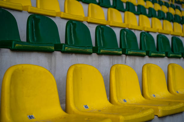 istock Empty green and yellow seats in the stadium. 2150491407