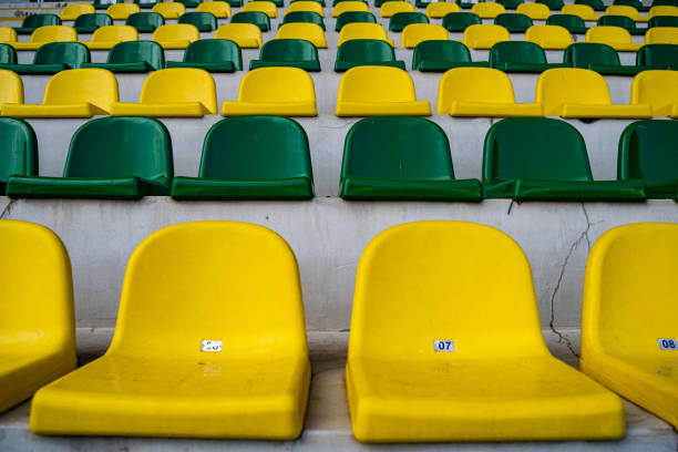 istock Empty green and yellow seats in the stadium. 2150491456