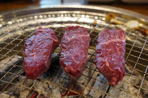 istock Thick beef grilled directly on a charcoal grill 2150491563