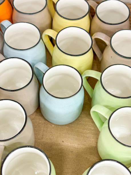 istock A row of colorful cups hanging on a rack 2150492759