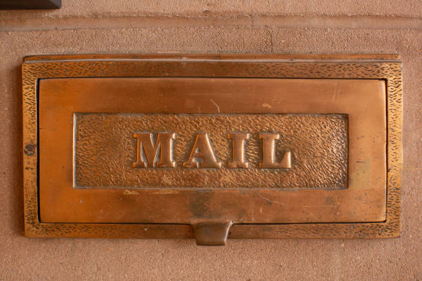 Close up detail of mail placement shute near the front entrance of the historic former Benedictine Sanctuary buildings on North Country Club Road, Tuscon, USA