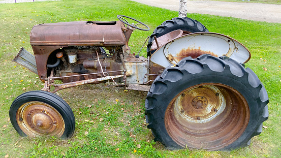 antique ferguson tractor. Massey Ferguson Limited is an American agricultural machinery manufacturer. The company was established in 1953 through the merger of farm equipment makers Massey-Harris of Canada and the Ferguson Company of the United Kingdom. It was based in Toronto, then Brantford, Ontario, Canada, until 1988. The company transferred its headquarters in 1991 to Buffalo, New York, U.S. before it was acquired by AGCO, the new owner of its former competitor Allis-Chalmers. Massey Ferguson is among several brands in a portfolio produced and marketed by American industrial agricultural equipment conglomerate AGCO and a major seller in international markets around the world.