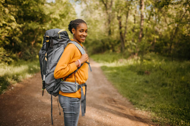 istock Young woman enjoying solo hiking 2150501143