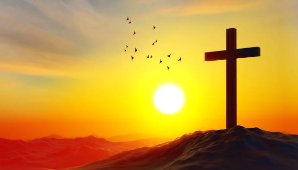 istock Christian cross against the sunset 2150505114