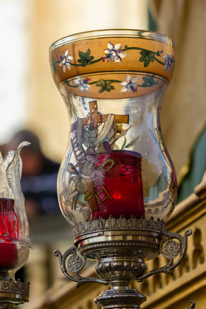 a still life with a vase and a candle taken at the Good Friday procession