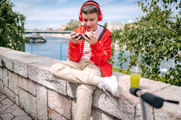 istock Teenager using mobile phone outdoors in the city 2150506542