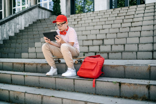 istock Teenager using digital tablet outdoors in the city 2150506824