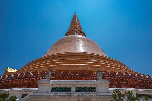 Wat Pra Thom Chedi, This place is an important Buddhist temple in Thailand and a famous tourist travel destination at Nakhon Pathom, Thailand. Big pagoda with a clear blue sky background.