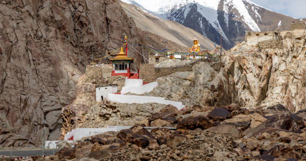 Small Buddhist temple and statue in the Indian Himalayan mountains
