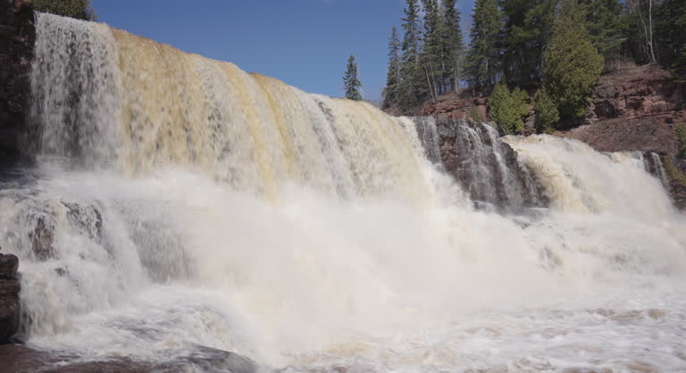 Gooseberry Falls Flowing Over Rocks in Sunny Weather