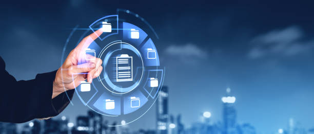 istock Man finger touch document management system hologram and city skyline 2150513141