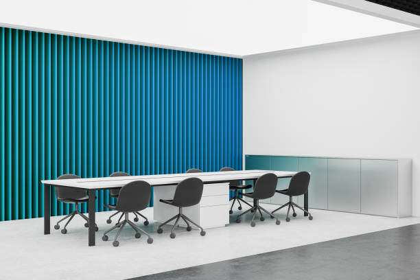 Corner view of office interior with chairs and meeting board, metal sideboard and blue wall panels. Conference space with minimalist furniture. Mock up empty wall partition. 3D rendering