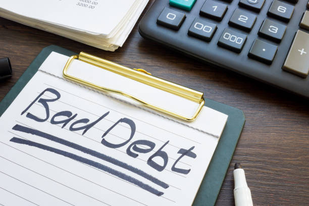 istock Bad debt concept. Financial report, calculator and note paper. 2150513662
