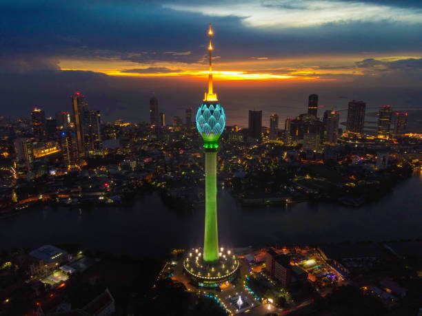Lotus Tower , Colombo , Sri Lanka The Lotus Tower is an iconic telecommunications and observation tower in Colombo, Sri Lanka. Standing at approximately 356 meters (1,168 feet), it is one of the tallest towers in South Asia. Its design is inspired by the lotus flower, symbolizing purity and unity. The tower serves as a hub for broadcasting and telecommunication services and offers a panoramic view of Colombo from its circular observation deck. It represents a symbol of modernity and progress for Sri Lanka and is a popular tourist attraction. sri lanka business stock pictures, royalty-free photos & images