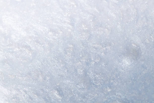Liquid paint abstract background. Pearl silver acrylic paints with shimmering glitter blending texture. Macro image