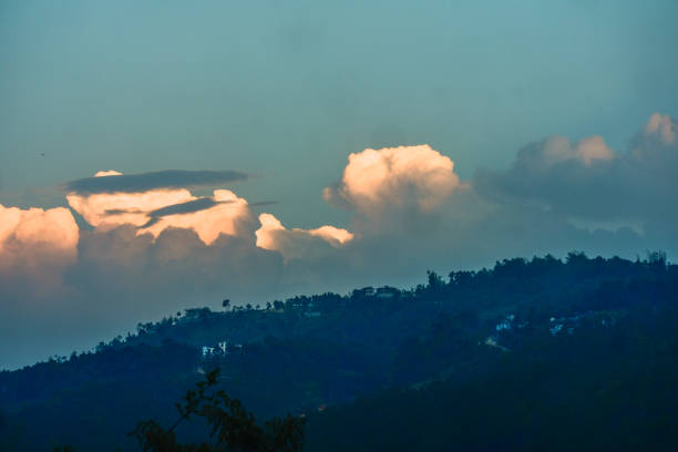 a breathtaking view of a hilly landscape with a dramatic sky.
