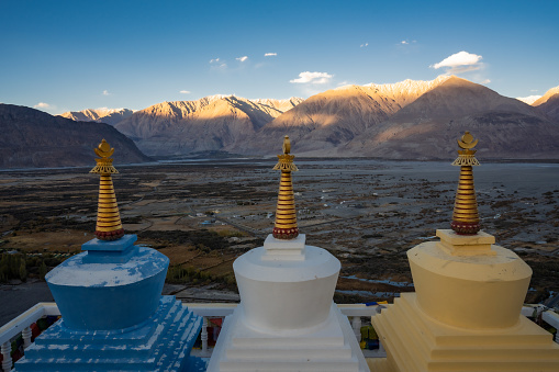 Stupa with mountain view at Diskit monastery in Nubra Valley of Ladakh, northern India.