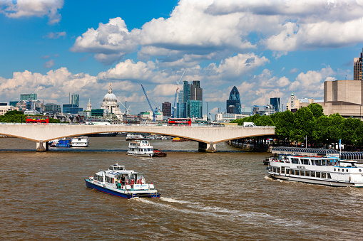 London, United Kingdom - June 29, 2010 : Boats for transport and tourism on the River Thames near Festival Pier.