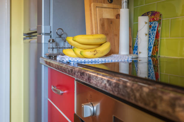 Fresh ripe banana fruit on kitchen tabletop .