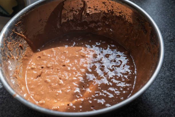 istock Chocolate cupcake mix inside metal mixing bowl closeup 2150518752