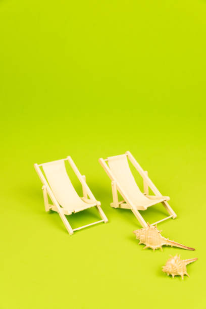 Home decor. Red deck chair on patio at sunset.