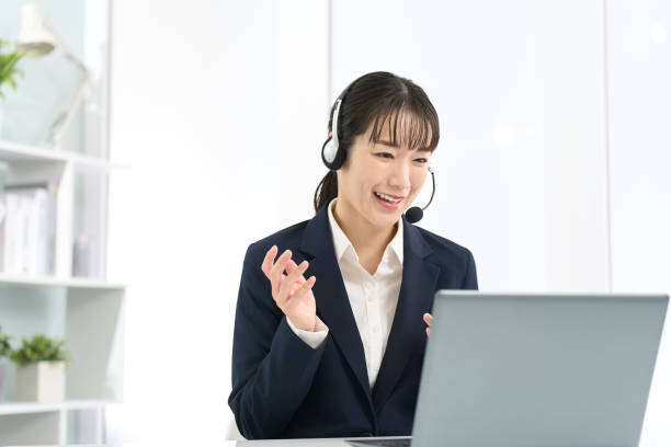 istock Business woman wearing a headset and having a conversation 2150521228