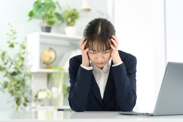 istock Business woman holding her head in front of a computer 2150521231