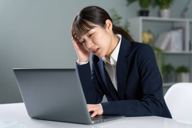 istock Business woman working overtime at night 2150521240