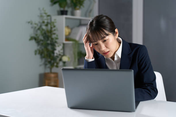 istock Business woman working overtime at night 2150521248