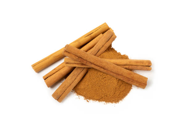 istock Cinnamon powder  isolated on white background. Spicy spice for baking, desserts and drinks. Fragrant ground cinnamon. 2150523058