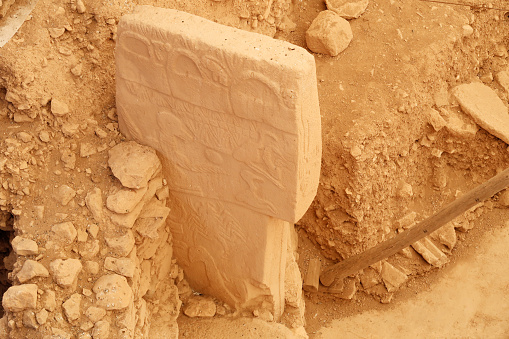 Pillar 43 in Enclosure D at the neolithic archaeological site of Göbekli Tepe, Potbelly Hill, a t-shaped pillar showing a bird, vulture, also called the Vulture Stone, close to Sanliurfa, Turkey 2022