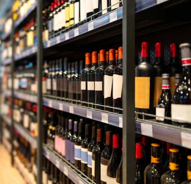 istock Wine bottles on shelves in the wine shop. 2150524519