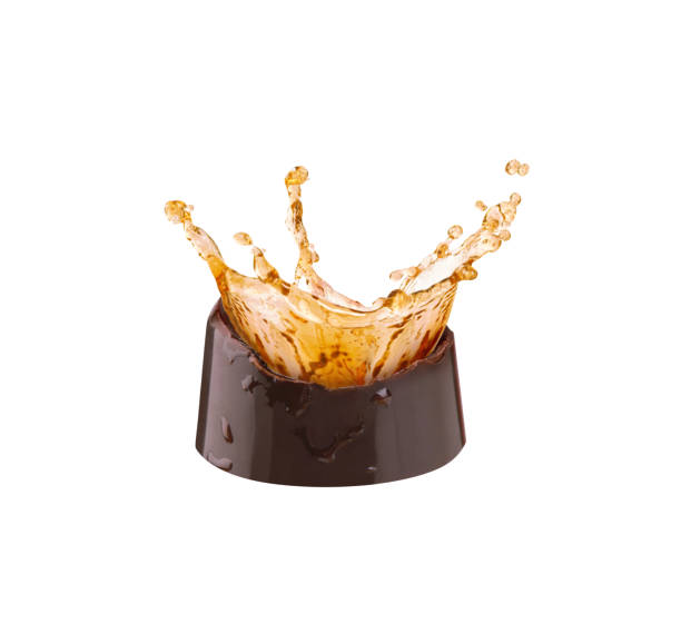 istock chocolate candy with a splash of brandy on a white background 2150525364