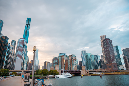 In the USA, Chicago, Illinois features the Chicago River, glass and steel buildings, with skyscrapers in the background, and downtown riverside, representing concepts of business, modern transportation, the financial district, the construction industry, business enterprise organization, and communication technology - The Chicago Loop