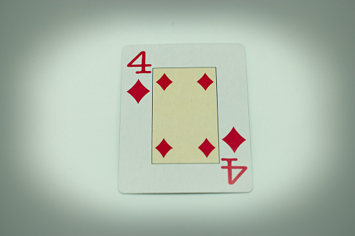 Dice and poker cards on white background