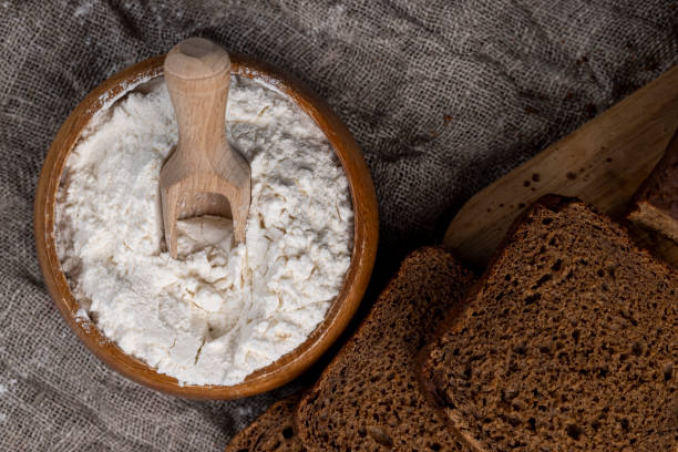 istock a square dark loaf of bread on the table 2150527910
