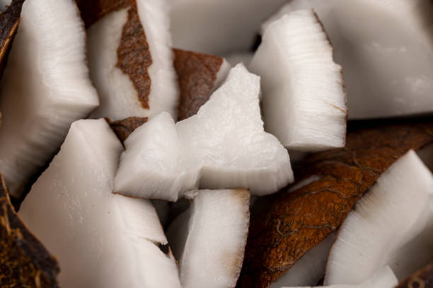 white coconut pulp and dried coconut flakes, a close-up of which is used in the preparation of desserts