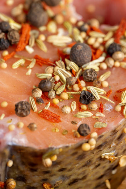 fresh raw red trout marinated in spices, fresh sliced red fish meat in spices