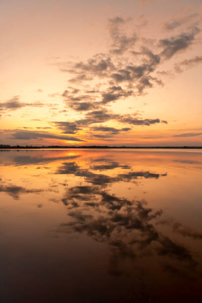 istock winter sunset on the lake after the ice melts 2150528715