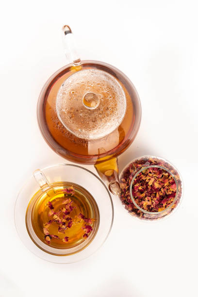 istock Tea made from tea rose petals in a glass bowl on white background. 2150528919