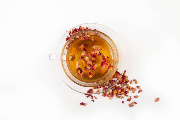 istock Tea made from tea rose petals in a glass bowl on white background. 2150528935