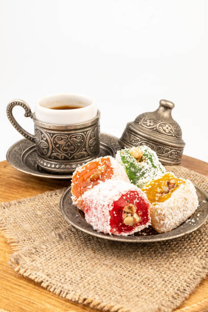 istock Turkish Coffee with Turkish Delight on authentic metal plate, isolated on white background 2150529012
