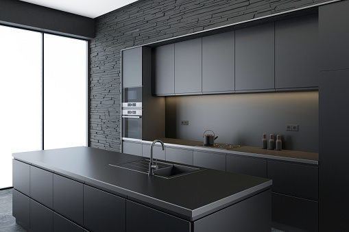Modern and minimalist apartment interior kitchen. Kitchen with long island. Dark materials with matte details finish. Modern furniture. 3d renderings. Slate rock stone wall. White background.